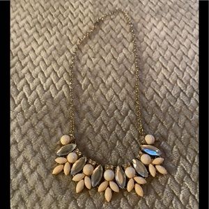 Soft pink necklace with reflective jewels